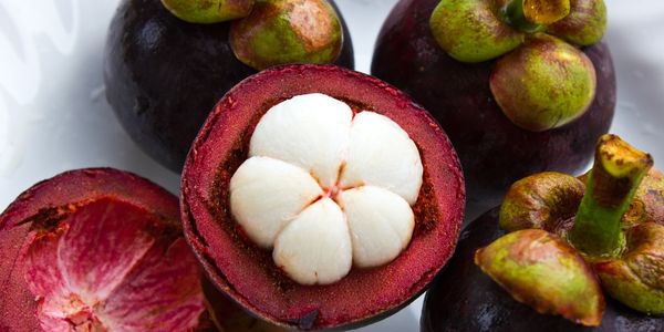 Emerald Drop Mangosteen is a purple fruit starting with e